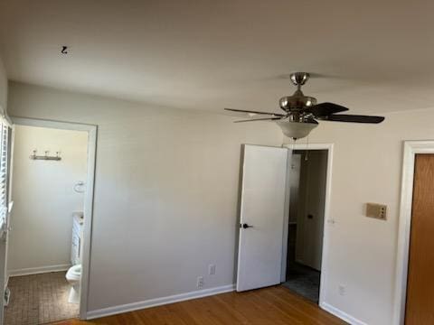 2416 N 69th St Unit 2418, Wauwatosa, WI 53213 - unfurnished bedroom with wood finished floors, baseboards, and ceiling fan