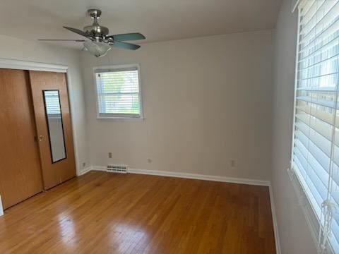 2416 N 69th St Unit 2418, Wauwatosa, WI 53213 - empty room featuring a ceiling fan, light wood finished floors, and baseboards