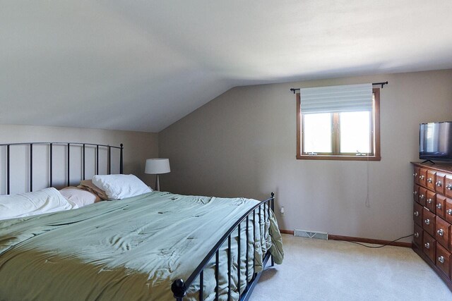 1810 W Upham Ct, Milwaukee, WI 53221 - carpeted bedroom with vaulted ceiling and baseboards
