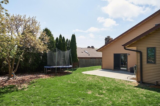 1810 W Upham Ct, Milwaukee, WI 53221 - view of yard featuring a patio area and a trampoline