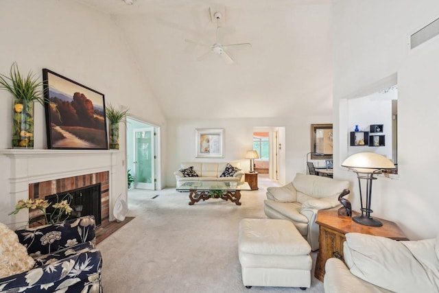 carpeted living area with a ceiling fan, high vaulted ceiling, and a brick fireplace