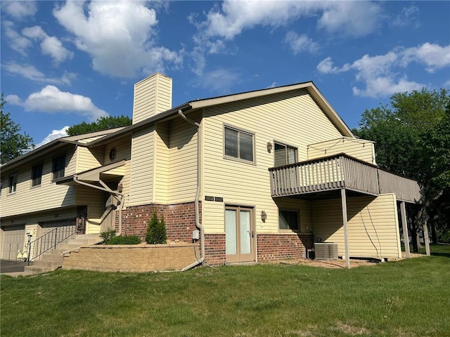 6640 Falstaff Rd, Saint Paul, MN 55125 - rear view of house featuring a yard, a chimney, brick siding, cooling unit, and an attached garage