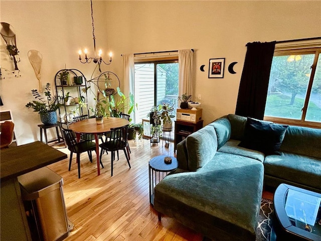 6640 Falstaff Rd, Saint Paul, MN 55125 - living room featuring light wood finished floors and a chandelier