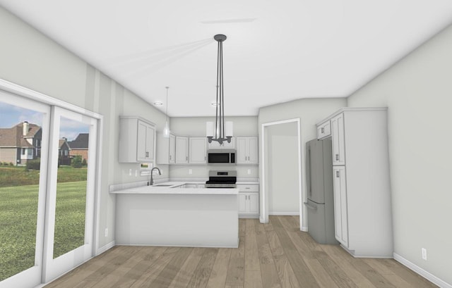 3916 32nd Ave Unit Lt120, Kenosha, WI 53144 - kitchen featuring stainless steel appliances, a sink, a peninsula, light wood-style floors, and light countertops