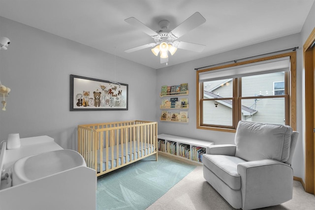 7217 Iris Bloom Dr, Madison, WI 53719 - carpeted bedroom featuring a crib and a ceiling fan