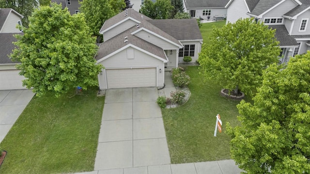 7217 Iris Bloom Dr, Madison, WI 53719 - view of front facade featuring a front yard, concrete driveway, and a shingled roof