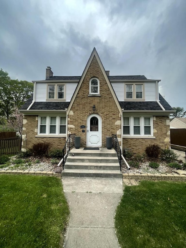 202 Lake Dr, South Milwaukee, WI 53172 - tudor home with a chimney and brick siding