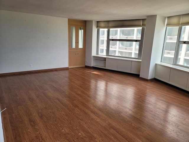 1610 N Prospect Ave Unit 506, Milwaukee, WI 53202 - empty room with dark wood finished floors and baseboards