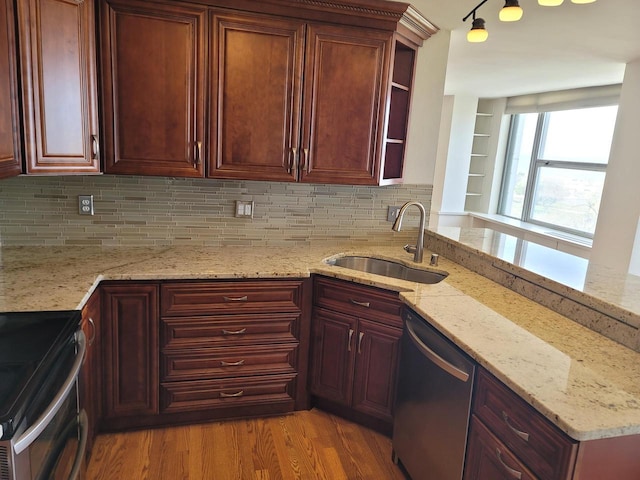 1610 N Prospect Ave Unit 506, Milwaukee, WI 53202 - kitchen featuring a sink, stainless steel appliances, open shelves, and tasteful backsplash