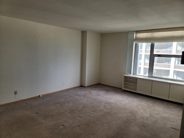 1610 N Prospect Ave Unit 506, Milwaukee, WI 53202 - carpeted empty room with baseboards