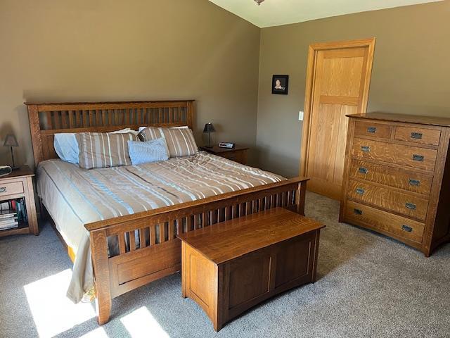 1030 Woodland Ct, Plover, WI 54467 - bedroom featuring light carpet