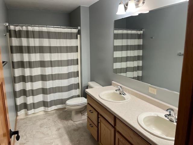 1030 Woodland Ct, Plover, WI 54467 - bathroom featuring toilet, tile patterned flooring, double vanity, and curtained shower