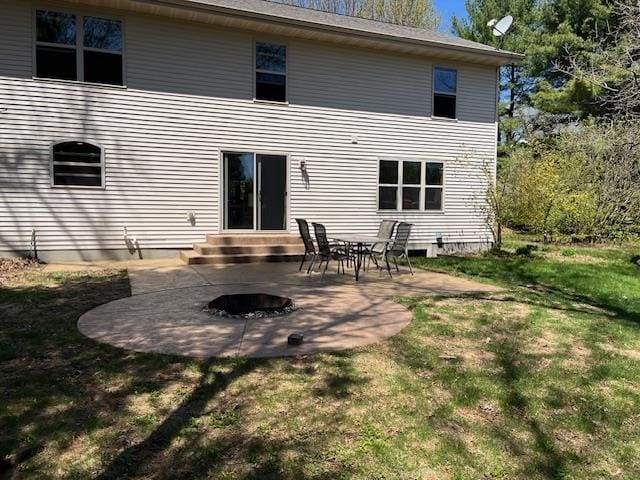 1030 Woodland Ct, Plover, WI 54467 - rear view of property featuring a patio area, a yard, and a fire pit