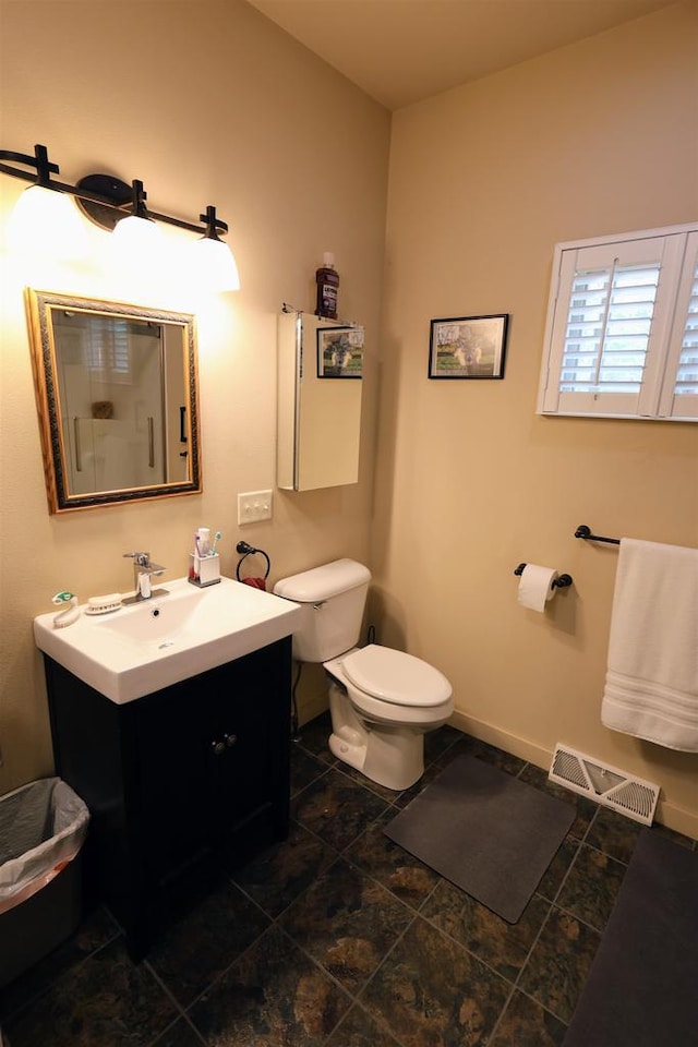 4905 Starlight Ln, Cassville, WI 53806 - bathroom featuring toilet, vanity, baseboards, and tile patterned flooring