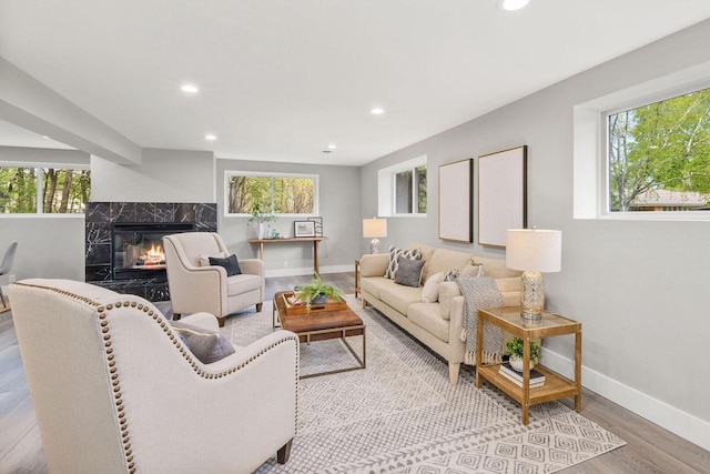 250 W Suburban Ct, Fox Point, WI 53217 - living area featuring plenty of natural light, light wood finished floors, recessed lighting, and a fireplace