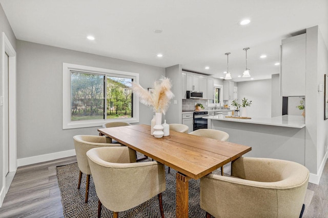 250 W Suburban Ct, Fox Point, WI 53217 - dining area with baseboards, recessed lighting, and light wood-style floors