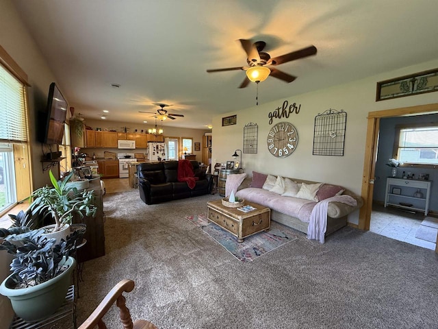 E12742 Weigands Bay N, Merrimac, WI 53561 - living area featuring a ceiling fan, healthy amount of natural light, and light colored carpet