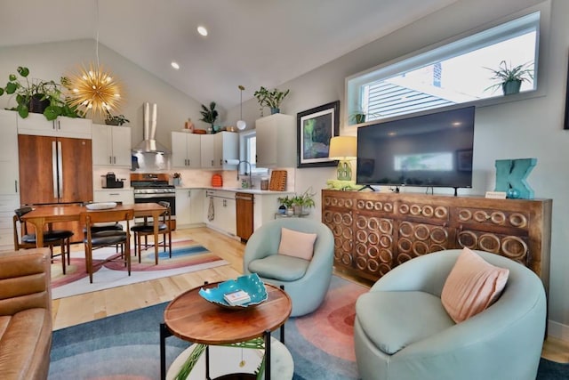 living room with light wood finished floors, recessed lighting, high vaulted ceiling, and a chandelier