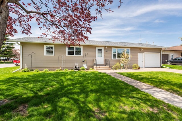 718 Tillman Dr, Onalaska, WI 54650 - ranch-style house with a garage, concrete driveway, and a front lawn