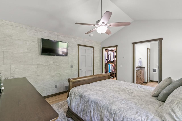 S7698 Grandview Ave, Merrimac, WI 53561 - bedroom featuring light wood-style floors, lofted ceiling, a spacious closet, a ceiling fan, and a closet