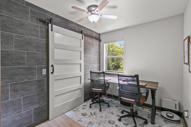 S7698 Grandview Ave, Merrimac, WI 53561 - office area featuring ceiling fan and a barn door