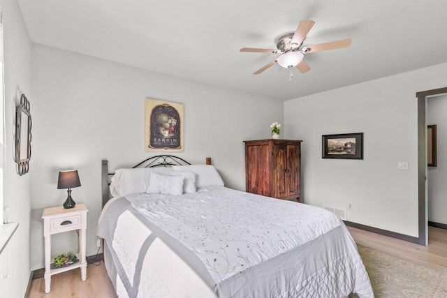 S7698 Grandview Ave, Merrimac, WI 53561 - bedroom featuring light wood-style flooring, baseboards, and ceiling fan