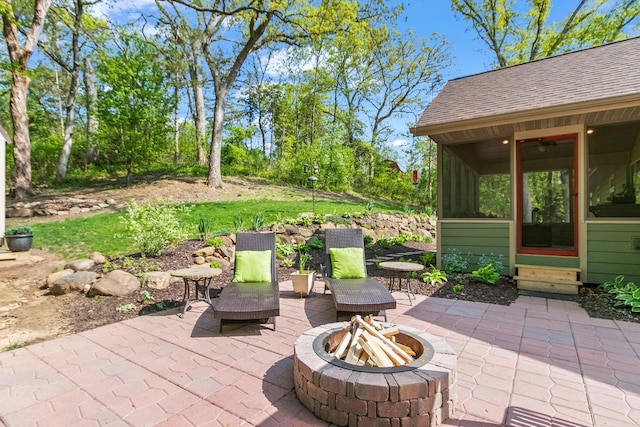 S7698 Grandview Ave, Merrimac, WI 53561 - view of patio / terrace featuring a fire pit, a sunroom, and entry steps