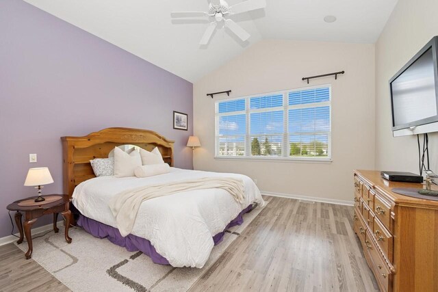 1885 Golfview Dr Unit 35-17, Lake Geneva, WI 53147 - bedroom with light wood-type flooring, lofted ceiling, baseboards, and a ceiling fan