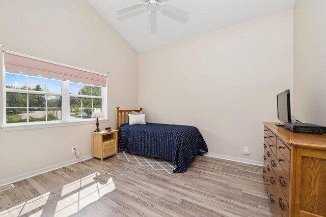 1885 Golfview Dr Unit 35-17, Lake Geneva, WI 53147 - bedroom with light wood finished floors, high vaulted ceiling, baseboards, and a ceiling fan