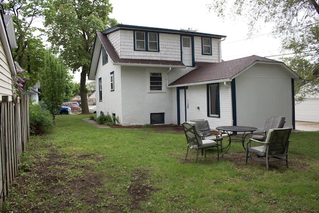232 Harrison Ave, Waukesha, WI 53186 - back of property with roof with shingles, a garage, and stucco siding
