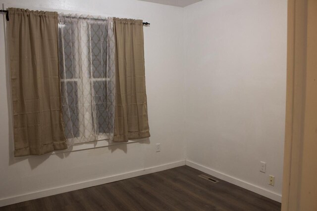 232 Harrison Ave, Waukesha, WI 53186 - spare room with baseboards and dark wood finished floors