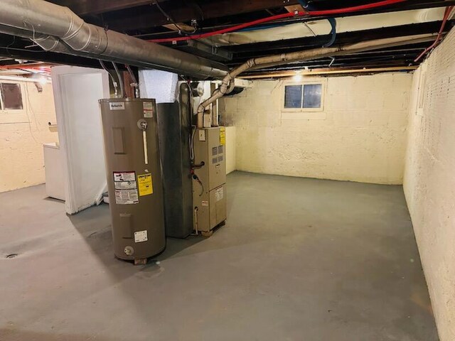 232 Harrison Ave, Waukesha, WI 53186 - unfinished basement with electric water heater and heating unit