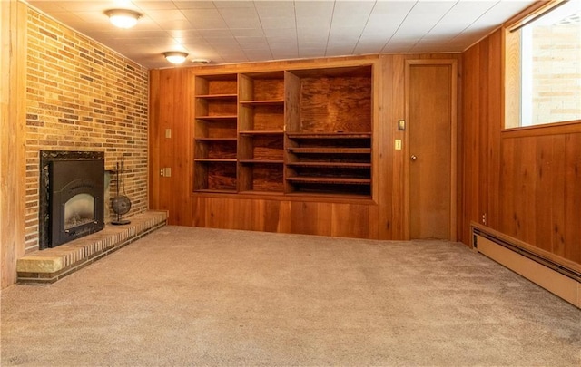 2126 Hogeboom Ave, Eau Claire, WI 54701 - unfurnished living room featuring wood walls, carpet, a fireplace, a baseboard heating unit, and built in features