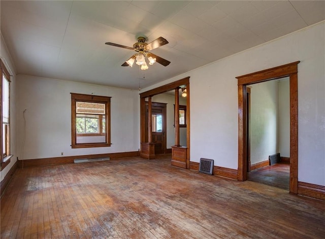 4190 County Road P, Spring Valley, WI 54767 - spare room with hardwood / wood-style flooring, a ceiling fan, and baseboards