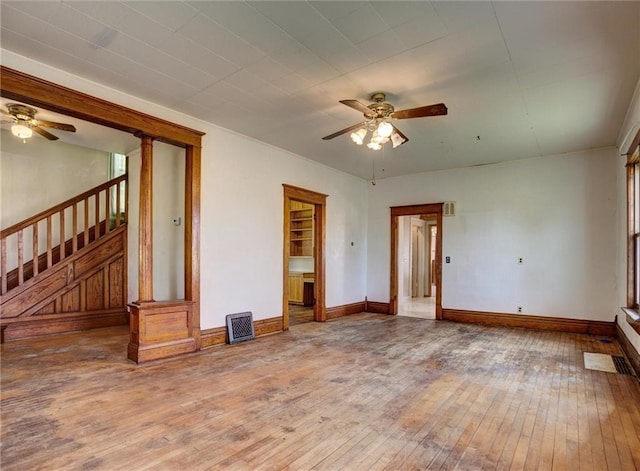 4190 County Road P, Spring Valley, WI 54767 - unfurnished room featuring ceiling fan, hardwood / wood-style flooring, stairway, and baseboards
