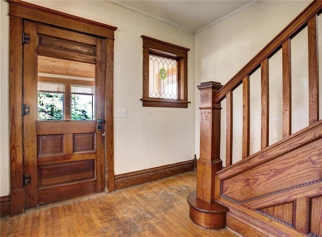 4190 County Road P, Spring Valley, WI 54767 - foyer featuring healthy amount of natural light, crown molding, hardwood / wood-style flooring, baseboards, and stairs