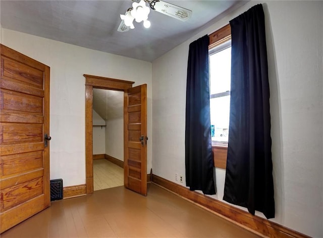 4190 County Road P, Spring Valley, WI 54767 - unfurnished bedroom with wood finished floors, baseboards, and ceiling fan
