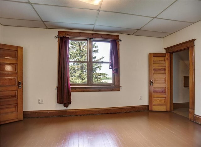 4190 County Road P, Spring Valley, WI 54767 - spare room with a drop ceiling, wood finished floors, and baseboards