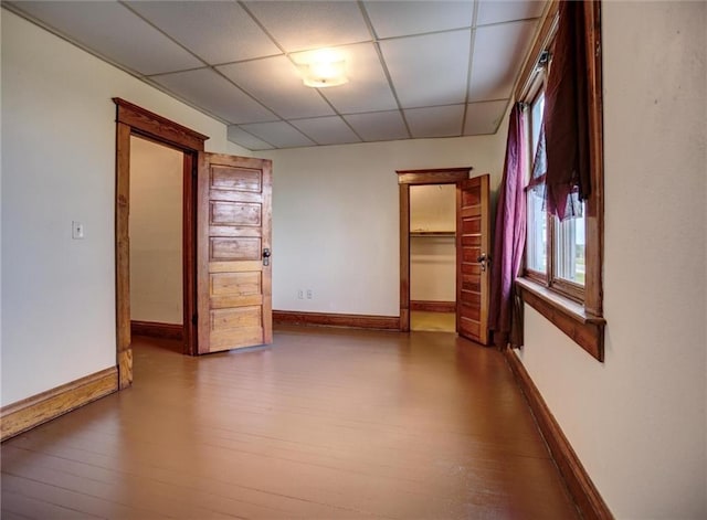 4190 County Road P, Spring Valley, WI 54767 - spare room with a paneled ceiling, wood finished floors, and baseboards