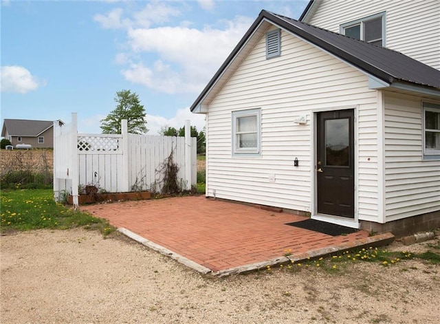 4190 County Road P, Spring Valley, WI 54767 - back of property featuring a patio, fence, and metal roof
