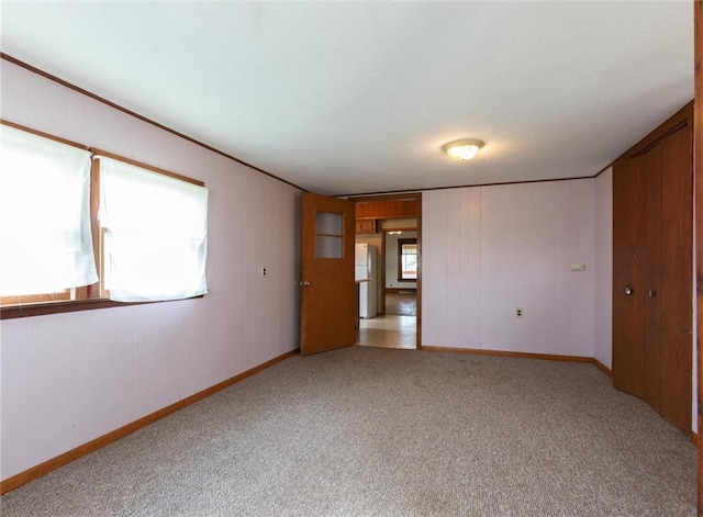4190 County Road P, Spring Valley, WI 54767 - unfurnished room with carpet flooring, baseboards, and wood walls