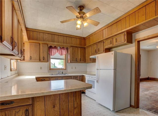 4190 County Road P, Spring Valley, WI 54767 - kitchen with freestanding refrigerator, electric stove, a peninsula, a sink, and light flooring