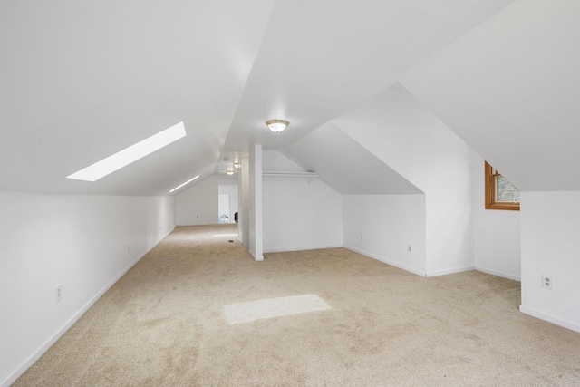 115 Glenwood Dr, Williams Bay, WI 53191 - bonus room featuring carpet flooring, a skylight, vaulted ceiling, and baseboards