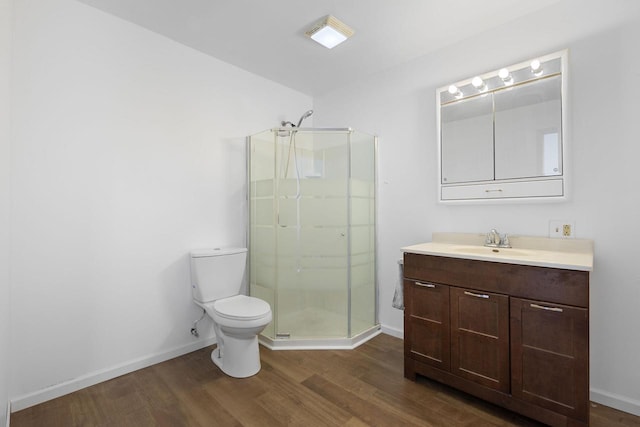 115 Glenwood Dr, Williams Bay, WI 53191 - bathroom with wood finished floors, a stall shower, toilet, and baseboards