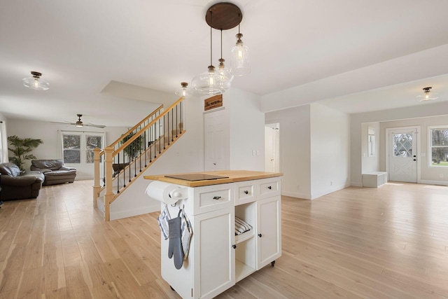 115 Glenwood Dr, Williams Bay, WI 53191 - kitchen featuring open floor plan, wooden counters, light wood-style flooring, and white cabinetry
