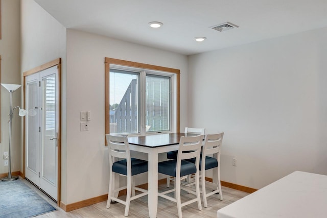1204 Lakeview Dr # 6, Tomah, WI 54660 - dining room with light wood-style flooring and baseboards