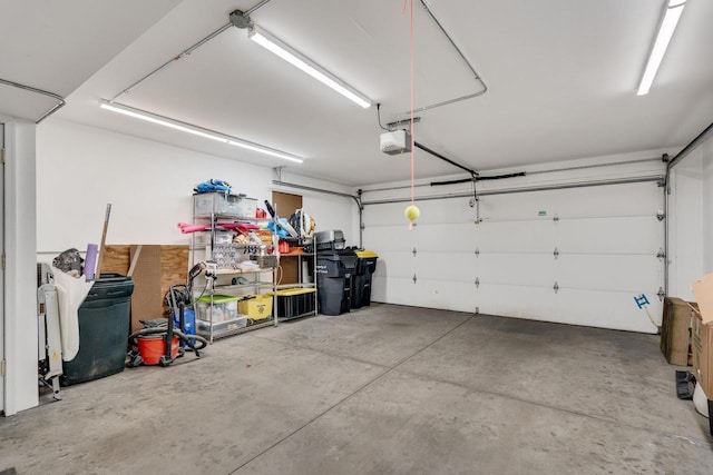 1204 Lakeview Dr # 6, Tomah, WI 54660 - garage featuring a garage door opener