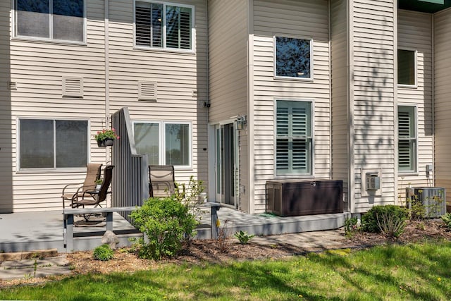 1204 Lakeview Dr # 6, Tomah, WI 54660 - rear view of house with central air condition unit and a patio area