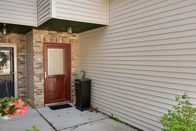 1204 Lakeview Dr # 6, Tomah, WI 54660 - doorway to property featuring brick siding