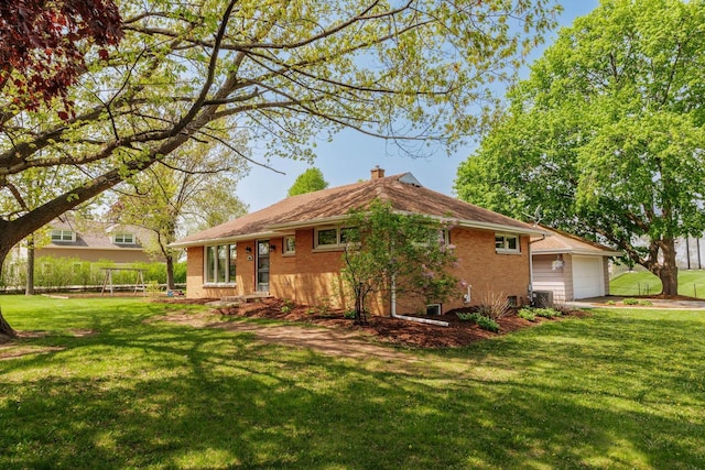 view of property exterior with brick siding, a chimney, a garage, and a lawn